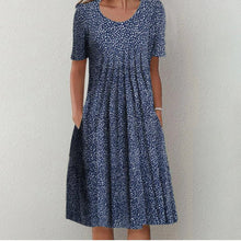 Gigie | Elegantes Blumenkleid in Blau mit Punkten