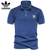 Herren-Poloshirt mit Blumenakzent in Blau