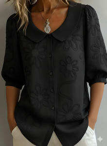 Blerta – Bluse Mit Blumen Muster Und Natürlicher Eleganz in Schwarz